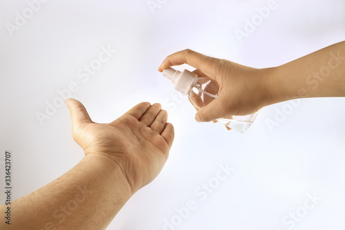 hands of a woman use sanitizer