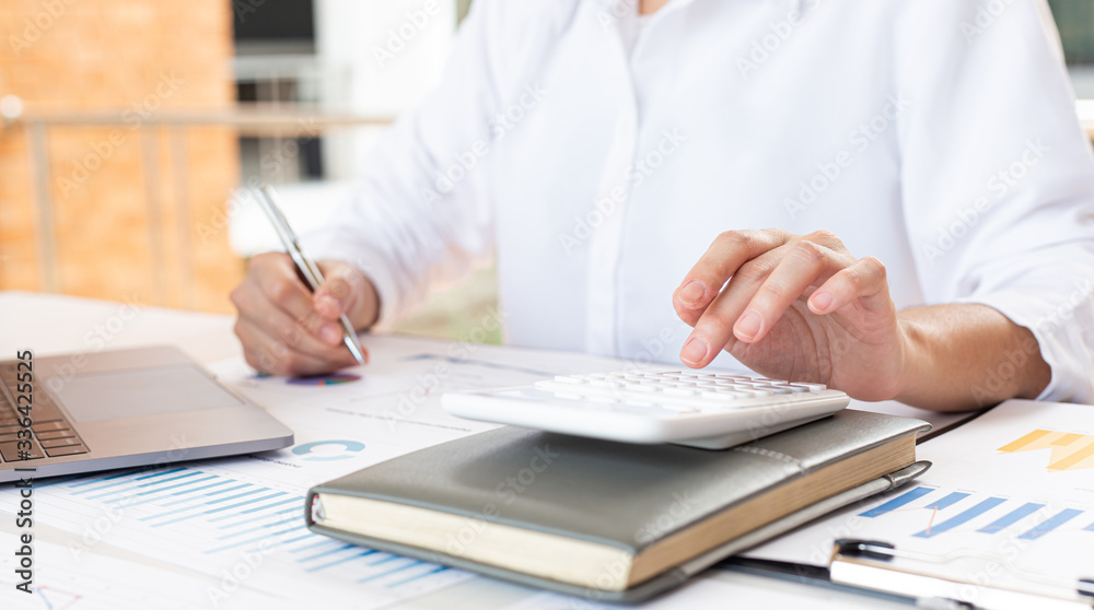Accounting businessmen are calculating income-expenditure and analyzing real estate investment data, Financial and tax systems concept. Accounting businessmen are calculating income-expenditure and analyzing real estate investment data, Financial and tax systems concept.