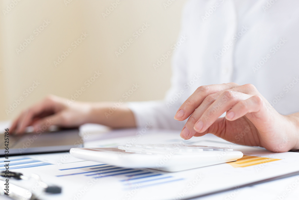 Accounting businessmen are calculating income-expenditure and analyzing real estate investment data, Financial and tax systems concept. Accounting businessmen are calculating income-expenditure and analyzing real estate investment data, Financial and tax systems concept.