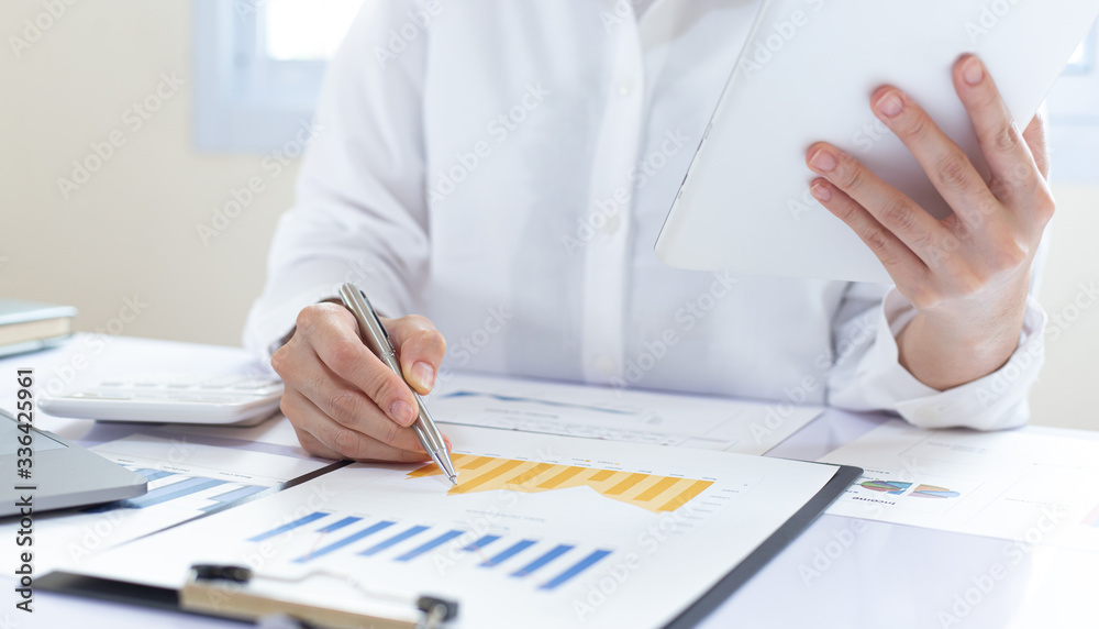 Financial business people are analyzing and examining Revenue - expense of real estate of the company, Financial and tax systems concept.