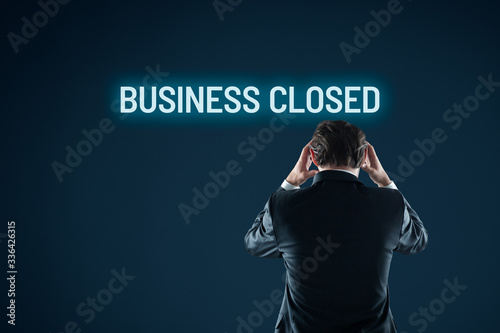 Business closed bankruptcy concept. Businessman is horrified by bankruptcy. photo