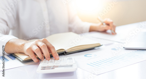 Accounting businessmen are calculating income-expenditure and analyzing real estate investment data, Financial and tax systems concept.