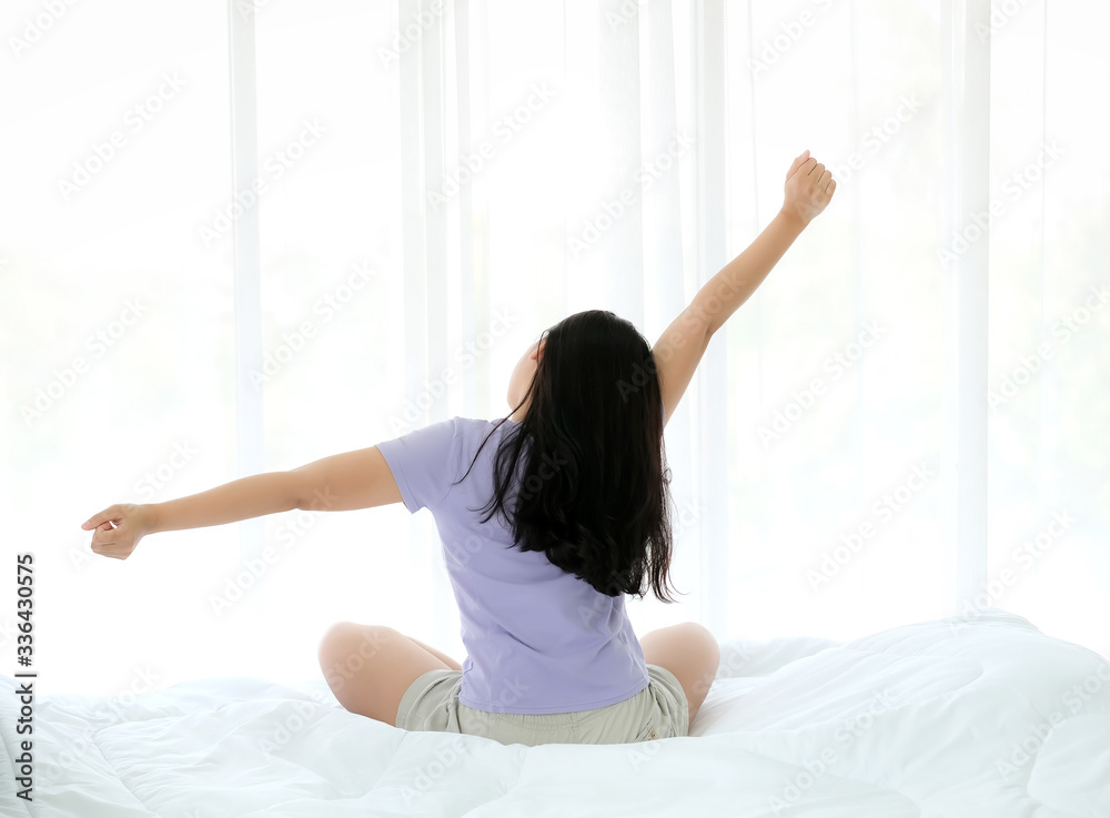 Young beautiful Asia woman wake up and feeling relaxing in the morning isolated on white background. Feeling fresh and ready. Resting, good dream and sleep concept. Young beautiful Asia woman wake up and feeling relaxing in the morning isolated on white background. Feeling fresh and ready. Resting, good dream and sleep concept.