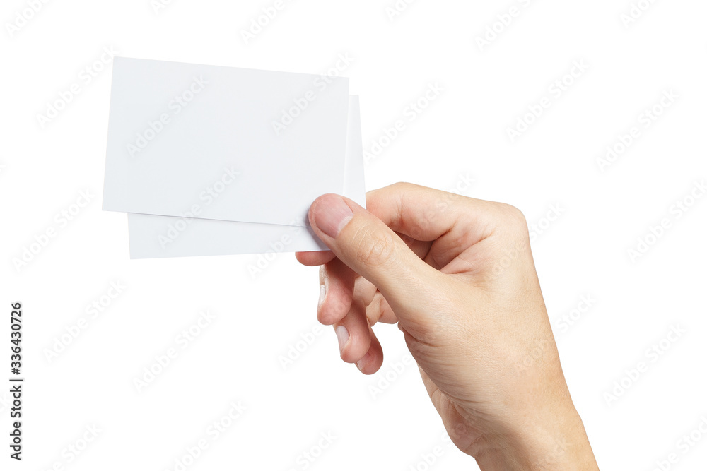 Hand with two pieces of paper or plastic (cards, tickets, flyers, invitations, coupons, banknotes, etc.), isolated on white background Hand with two pieces of paper or plastic (cards, tickets, flyers, invitations, coupons, banknotes, etc.), isolated on white background
