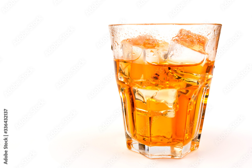 Glass of scotch whiskey and ice over white background. Glass of scotch whiskey and ice over white background.