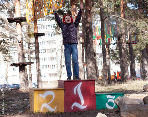 happy happy boy on a pedestal in the first place