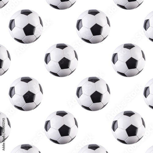 Seamless pattern of balls. Black and white soccer balls flying in the air  isolated on white background. Minimalistic concept of sports