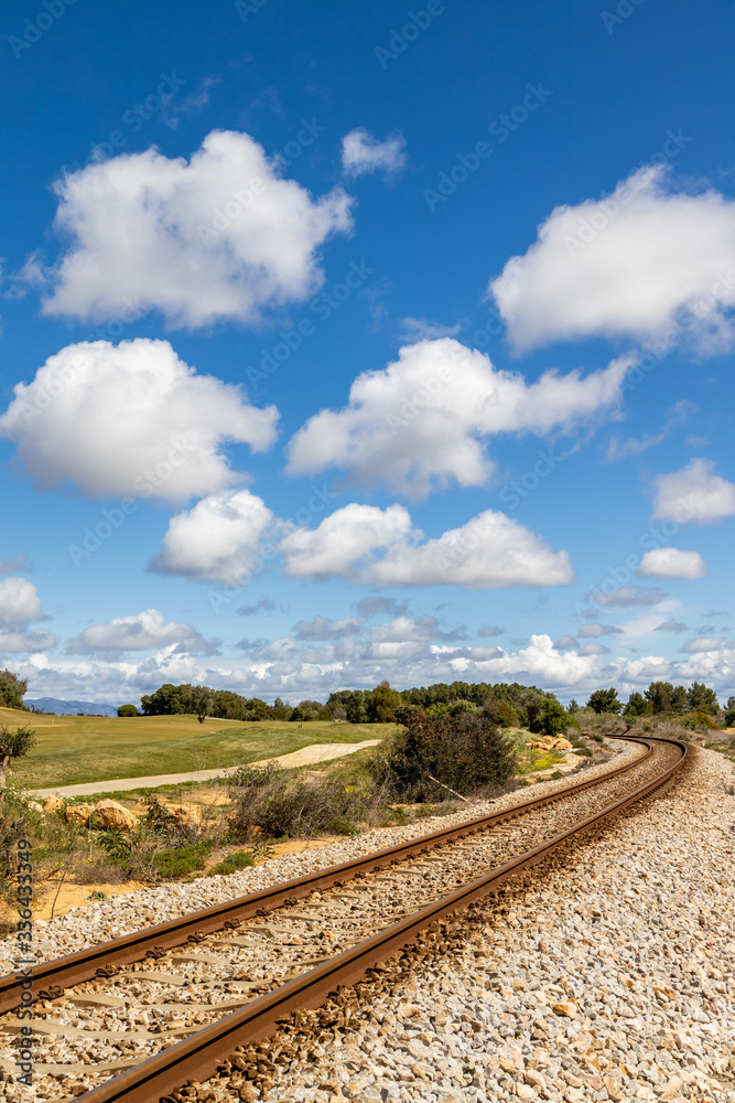 Train railway near golf course 