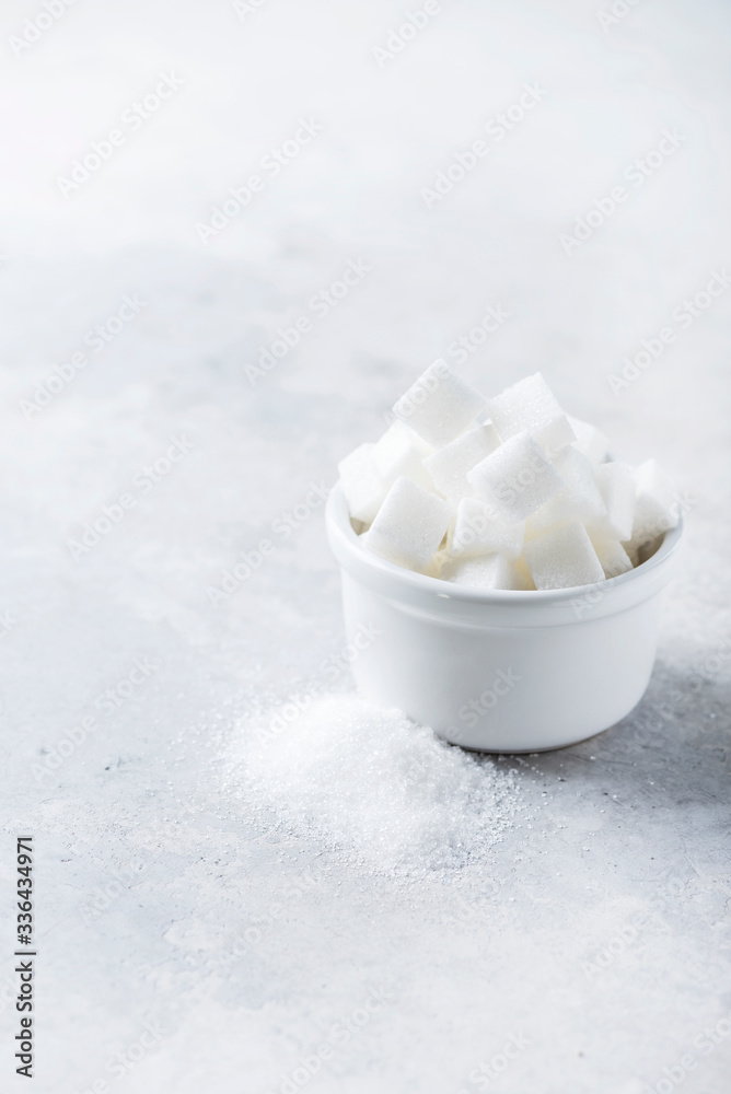 Sugar cubes and grain of sugar Sugar cubes and grain of sugar