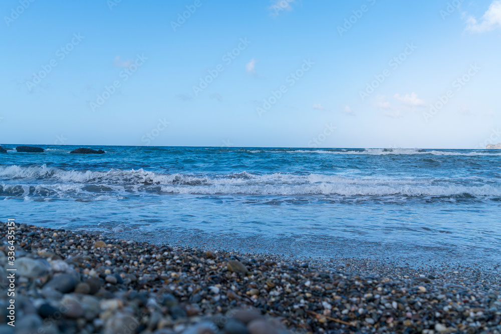 waves on the sea and stone beach