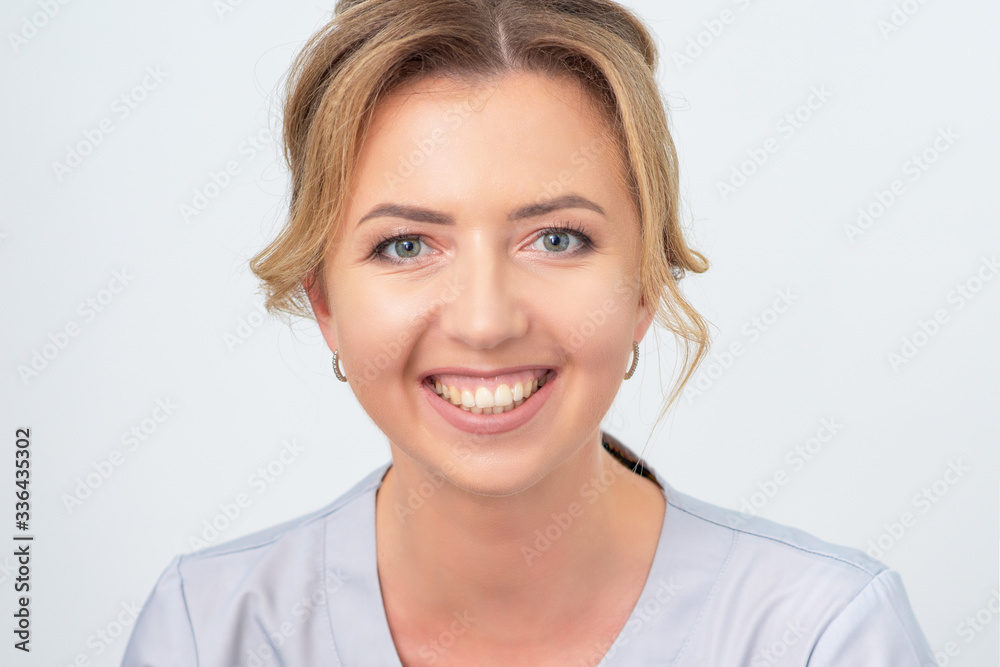 Portrait of a beautiful caucasian woman smiling on white background. Portrait of a beautiful caucasian woman smiling on white background.