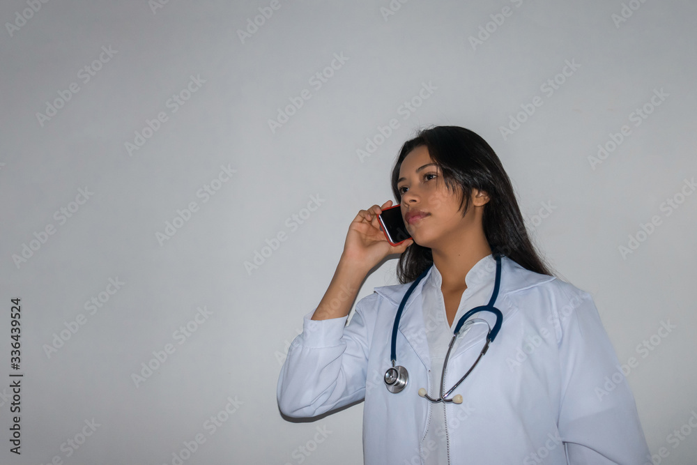 doctor or nurse call by cell phone. Woman in gown and stethoscope around neck talking to medical patients doctor or nurse call by cell phone. Woman in gown and stethoscope around neck talking to medical patients