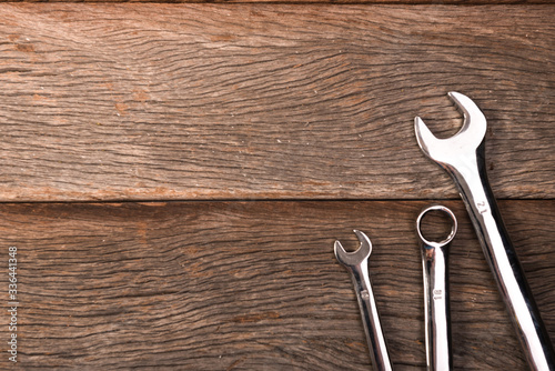 wrenches on wooden background