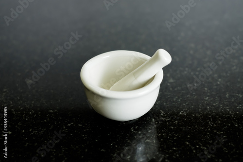 Small porcelain mortar & pestle lab kitchen pharmacy medicine herb pill crusher on black table