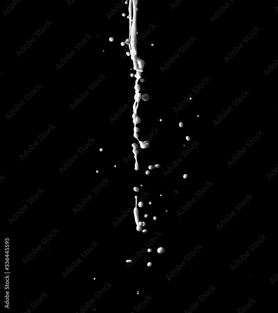 spray of milk on black background