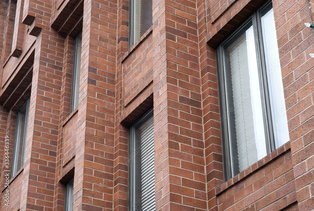 Detail of a brick facade of a building.
