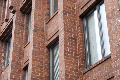 Detail of a brick facade of a building.