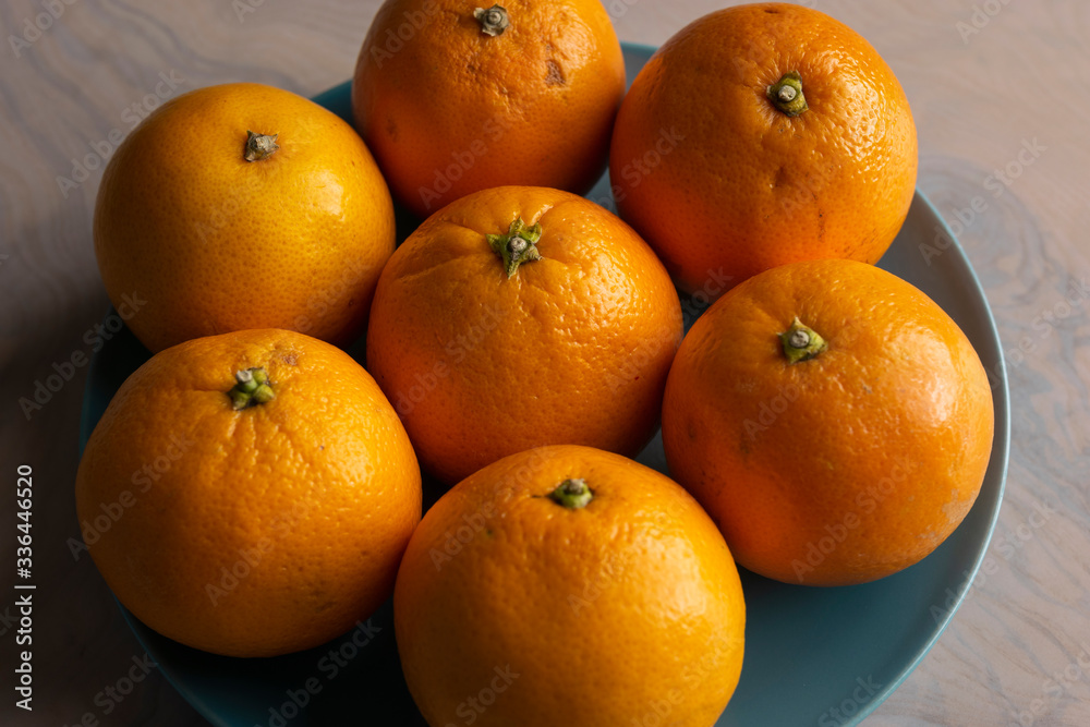Fruit plate with oranges on a dining table for healthy dish Fruit plate with oranges on a dining table for healthy dish