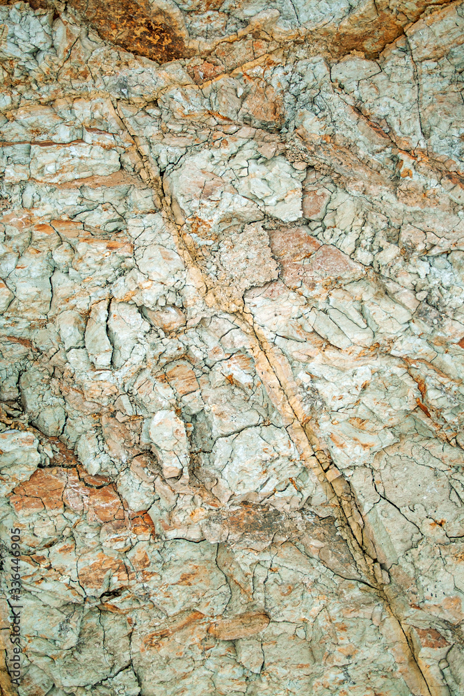 Rough clay rock and dirt under ground texture, Earth brown dry mud pattern background vertical