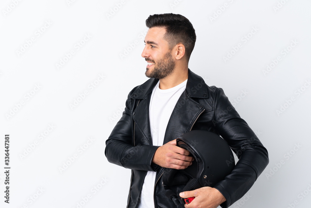 Man with a motorcycle helmet looking to the side Man with a motorcycle helmet looking to the side