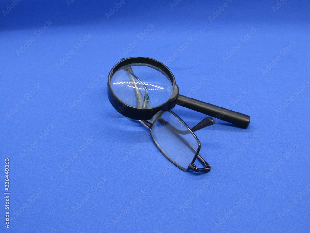Fototapeta premium Glasses for improving vision and magnifying glass.