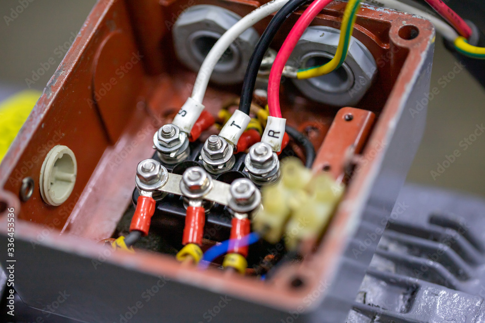 electrical cables connecting with terminal of motor in cover box of Power  induction motor pump.Motor Terminal Box . Stock Photo | Adobe Stock