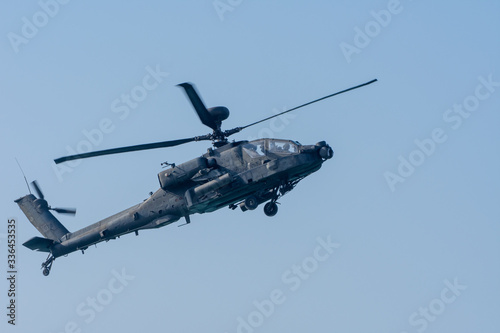 Military chopper in war flies through the sky. Military concept of power  force  strength  air raid.