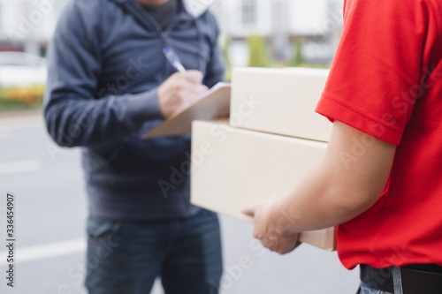 image of man holding box delivery themes and express delivery.