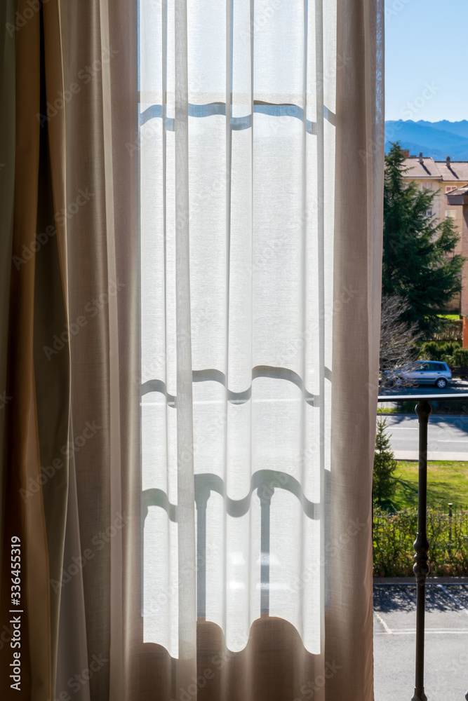 White transparent curtains in a balcony. White transparent curtains in a balcony.