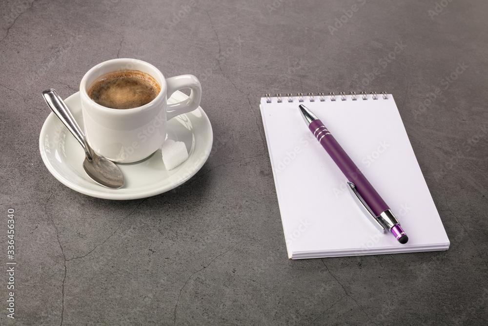 Coffee cup with a notebook Coffee cup with a notebook
