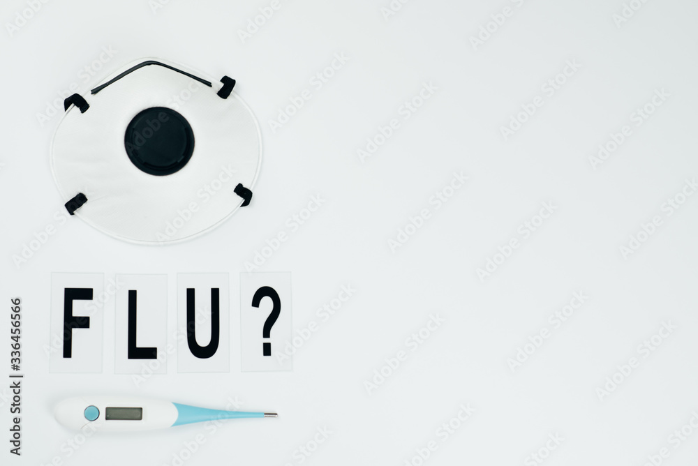 big black question flu on white background witn termometer and mask big black question flu on white background witn termometer and mask