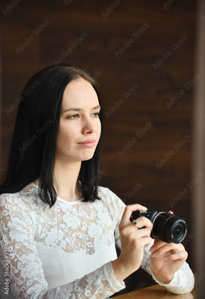 Young woman photographer with digital camera Young woman photographer with digital camera