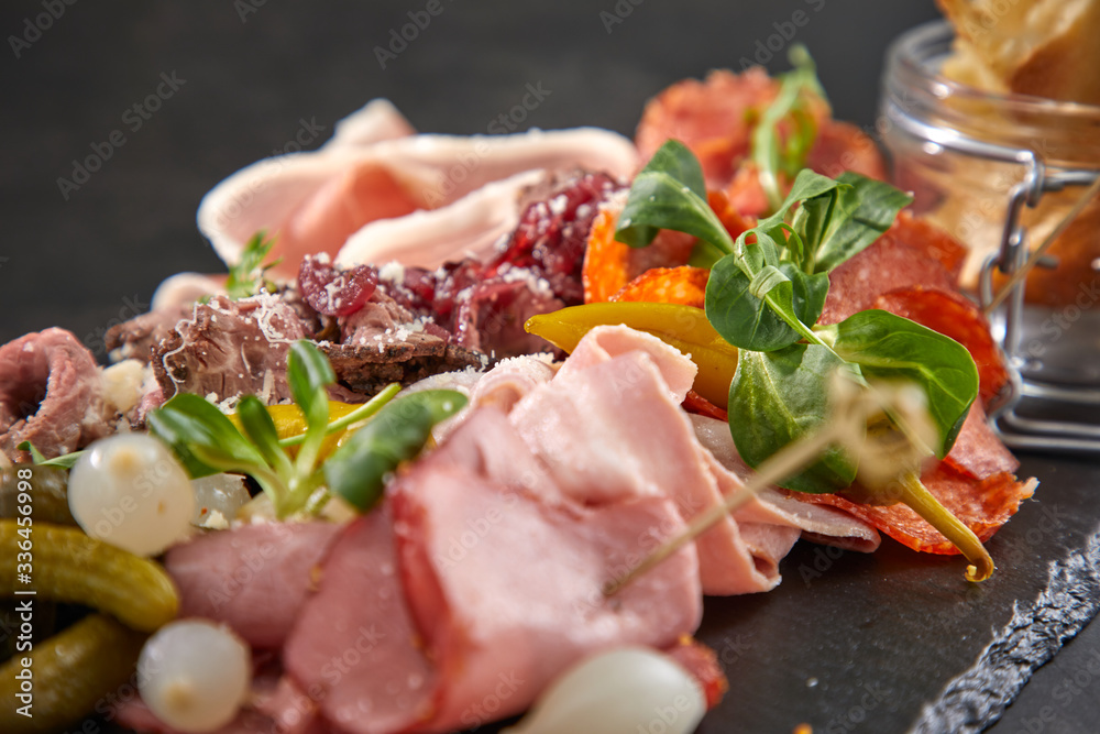 meat appetizers on the black background meat appetizers on the black background