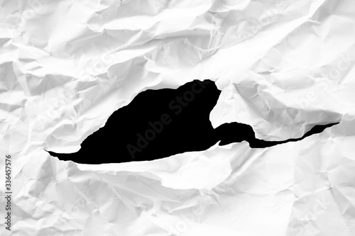 Fototapeta Naklejka Na Ścianę i Meble -  white torn paper on black background. 