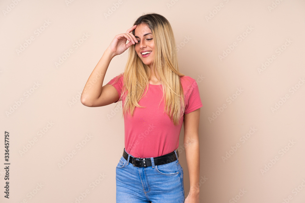 Young Uruguayan woman over isolated background laughing Young Uruguayan woman over isolated background laughing