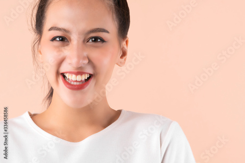 beautiful asian attractive female face close up casual dress laugh and big smile happiness surprise expression,pretty asian woman toothy smile wide mouth color background