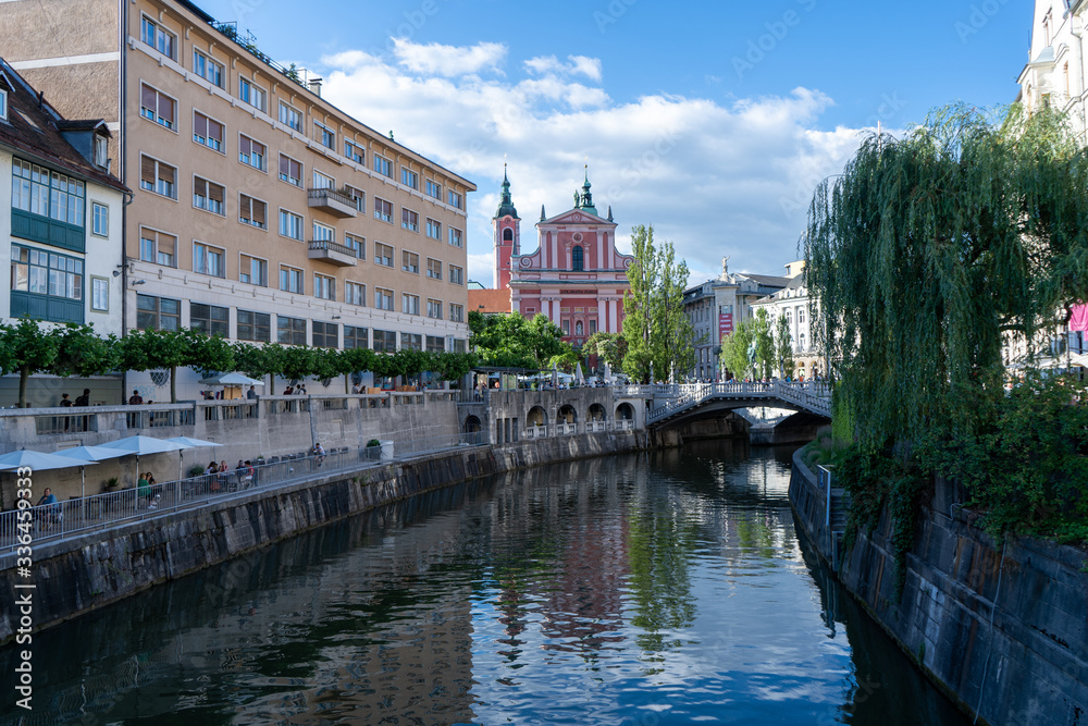 Beautiful view of the river in Ljubljana, the capital of Slovenia. Historical buildings and bridge over the river.