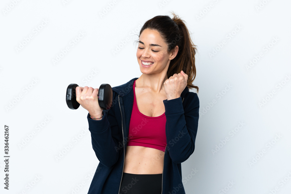 Sport woman making weightlifting over isolated white background celebrating a victory Sport woman making weightlifting over isolated white background celebrating a victory