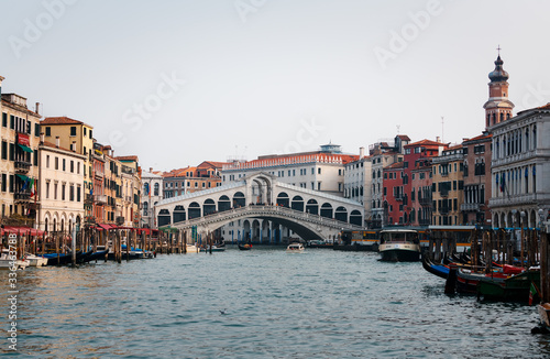 Venice, Italy - February 18, 2020: The Rialto Bridge (Ponte di Rialto), the oldest of the four bridges spanning the Grand Canal in Venice, Italy. 