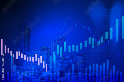 double exposure stock graph fibonacci indicator and cityscape view in blue background, business or financial chart concept