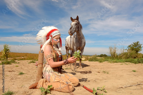 An young Indian girl is seen in a crop field with 
her horse. Her unhappy face reveals that the land is 
drying out due to global warming effects.