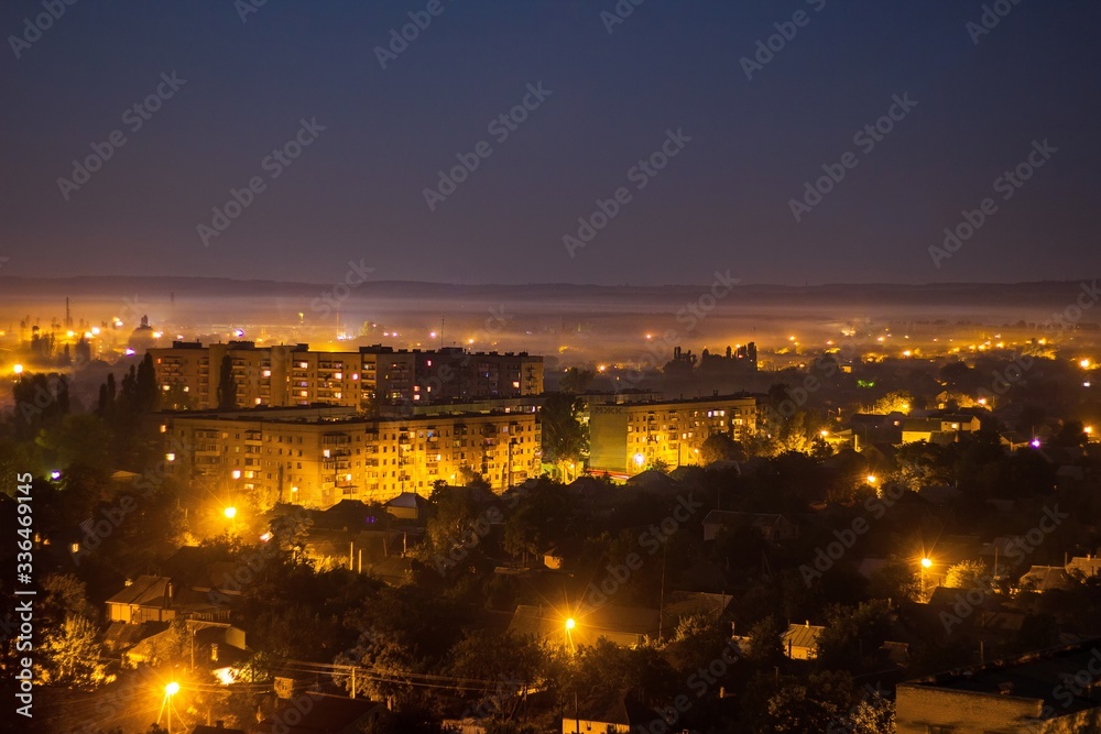 Panoramic view on Svetlovodsk city at night, Kirovohrad region, Ukraine. Top view, drone view on Taburische region in Svitlovodsk. Soft selective focus.