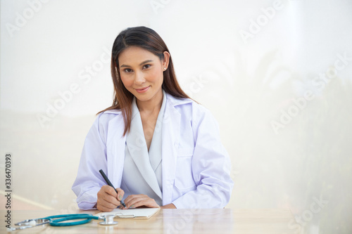 Young intern doctor women smile on isolate white background concept people working check for Coronavirus in medical hospital health care, Modern Nurse in medico clinic business service. Covid-19