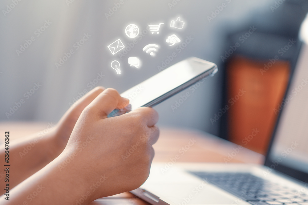 Hand using smart phone with Social media concept