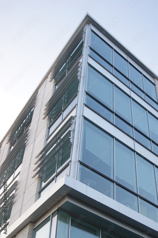 modern office building with glass windows modern office building with glass windows