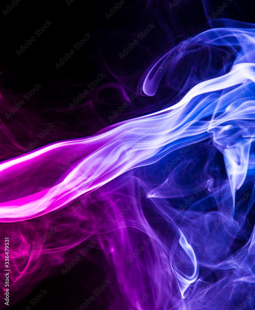 Fototapeta premium Colored smoke on black background