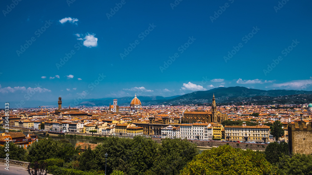 Beautiful aerial landscape of the city of Florence, Italy with various houses and church at sunset 