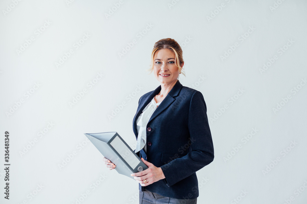 business woman at work with folders of documents in the office business woman at work with folders of documents in the office