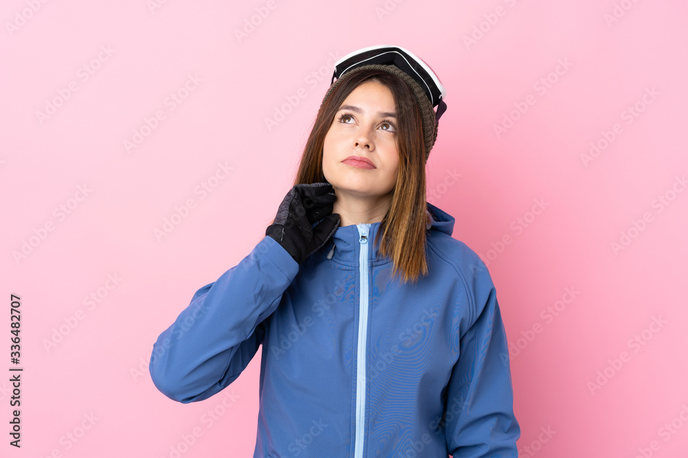 Young skier woman over isolated pink background thinking an idea Young skier woman over isolated pink background thinking an idea