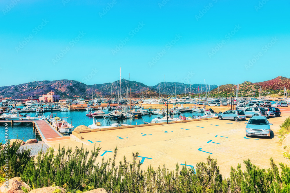 Boats at Villasimius Marina and Mediterranean Sea Sardinia Island Italy